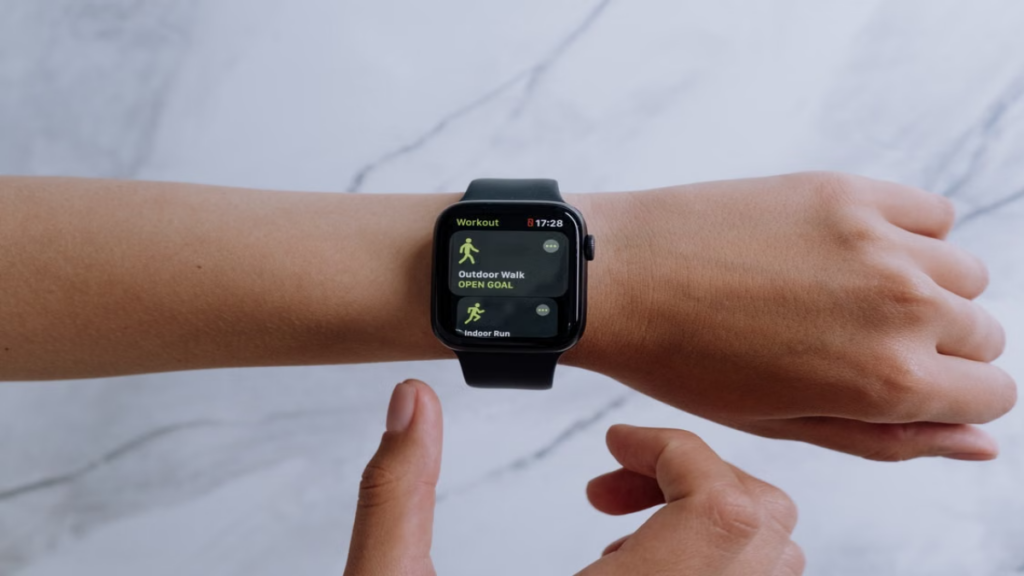 An athlete reviewing advanced biometric notifications delivered via a recent watchOS update and a complete smartwatch software update