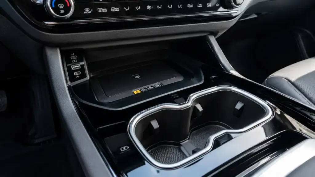 Center console ergonomics and storage compartment design inside the Kia Sportage cabin