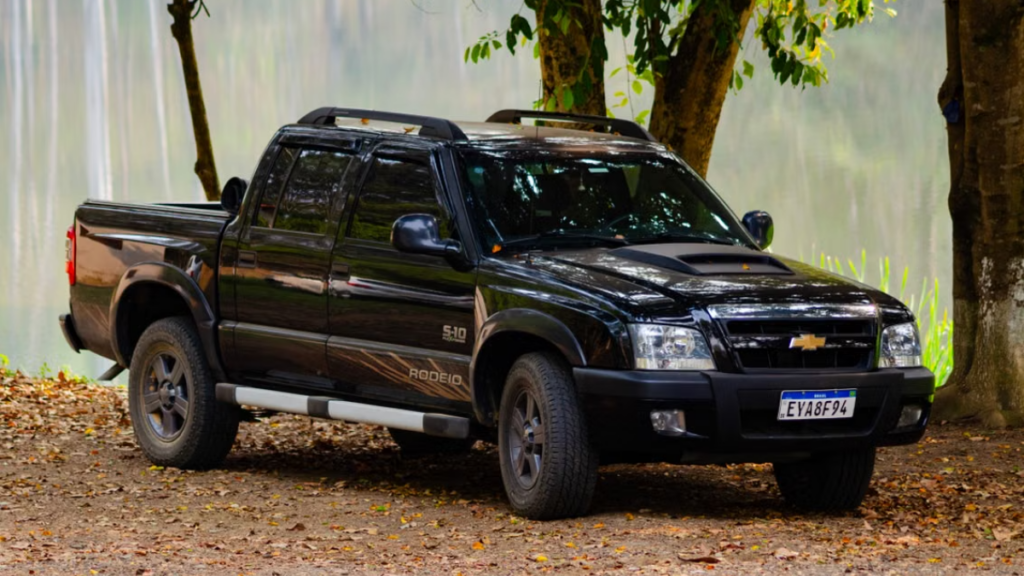 Chevrolet Avalanche Car parked on a gravel trail.