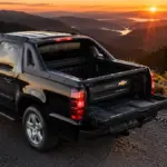 Chevrolet Avalanche Car parked on a mountain road