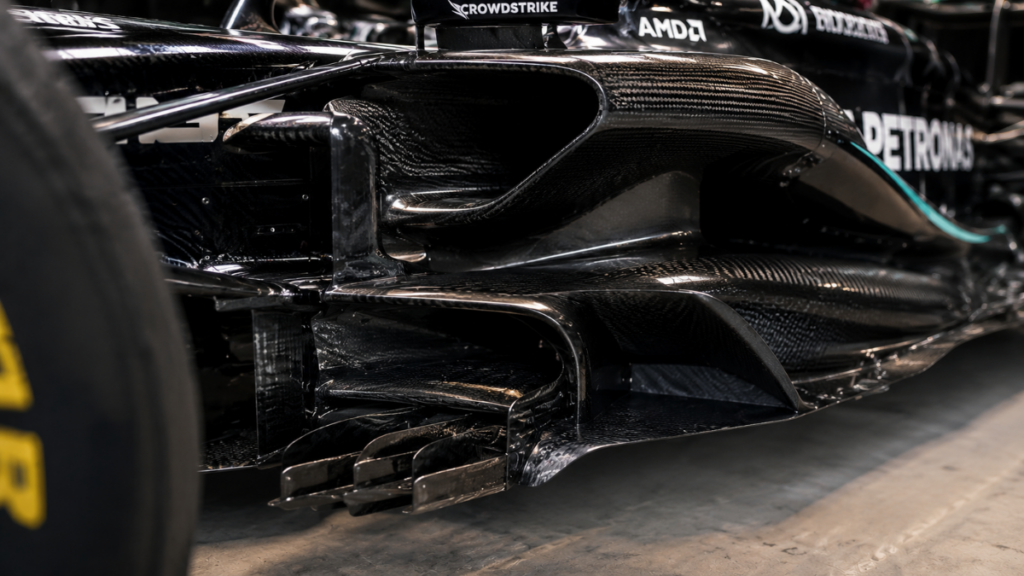 Complex aerodynamic curves of a real racing car compared to the LEGO Technic Aston Martin AMR26.