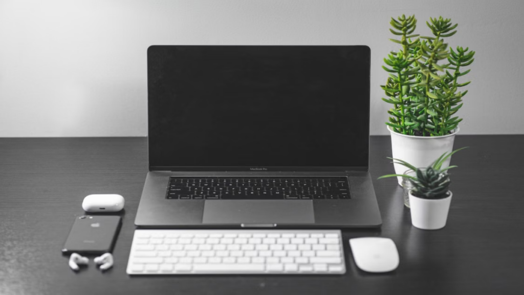 Consumer tech desk setup highlighting an analytical approach to the do I need new earbuds question AirPods Pro 3