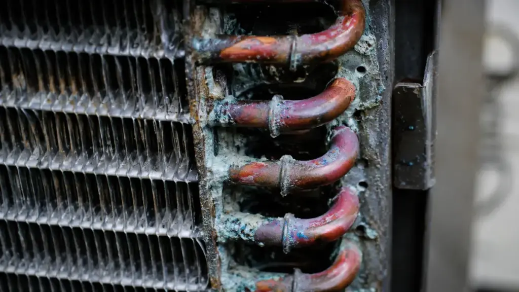Showing chemical buildup risks during window ac unit maintenance