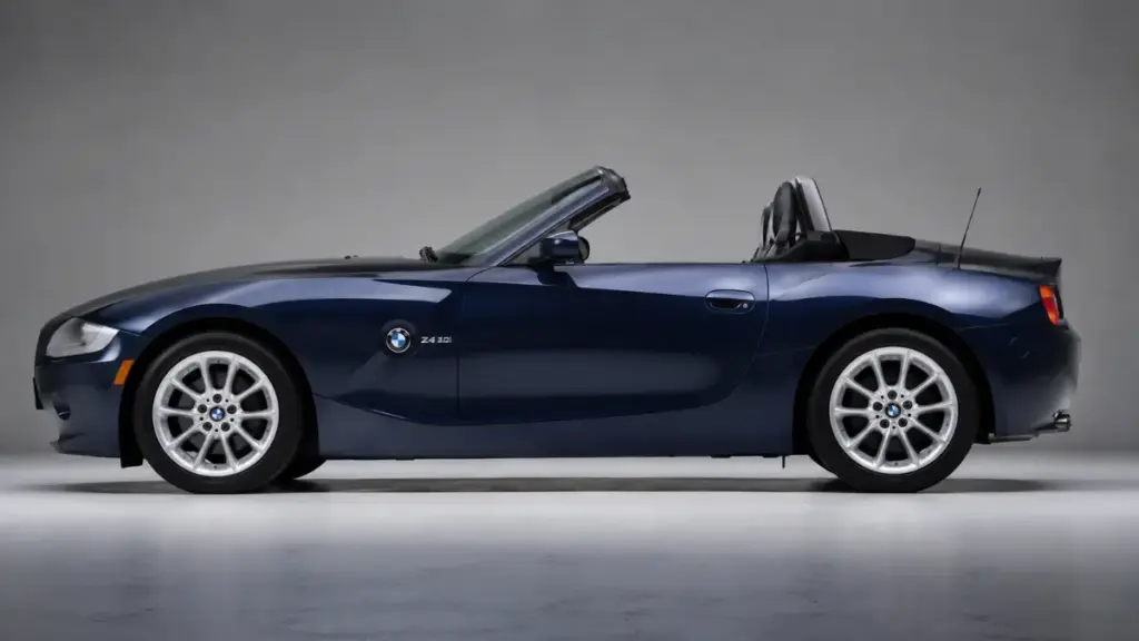 Side profile view of a 2004 BMW Z4 E85 rivaling the mid-engine Porsche Boxster.