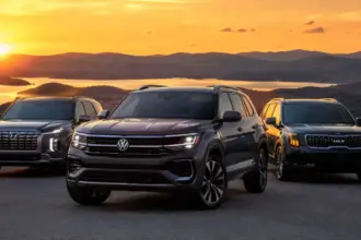 Volkswagen Atlas standing alongside Hyundai Palisade and Kia Telluride on a scenic overlook