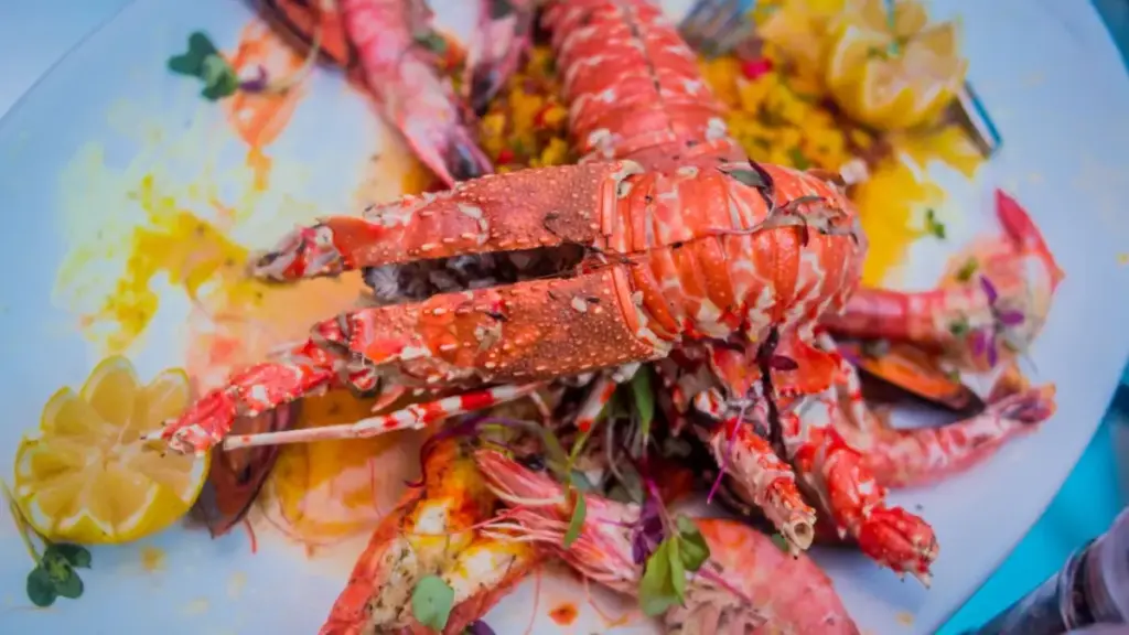 broiling-a-stuffed-lobster-shell-under-high-oven-heat-for-a-quick-gratin-finish