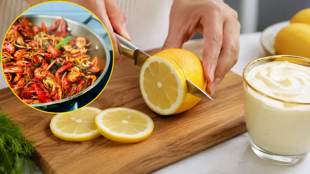 cutting-fresh-lemons-to-prepare-an-acid-catalyst-sauce-for-a-crayfish-thermidor-recipe