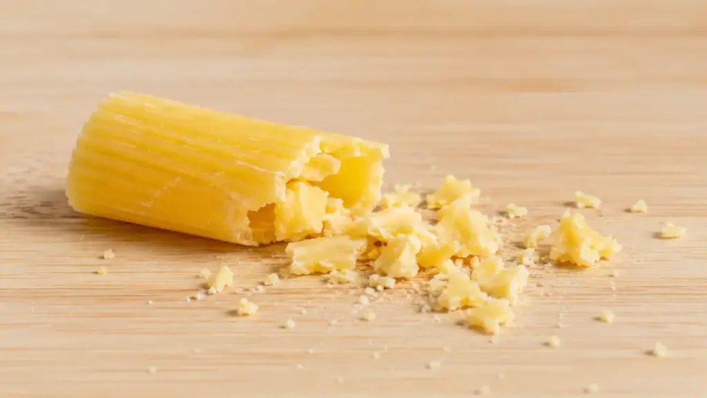 fragile-gluten-free-corn-pasta-tubes-crumbling-apart-on-a-cutting-board