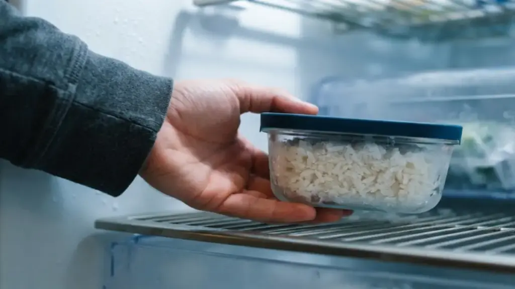 glass-container-of-frozen-cooked-rice-placed-inside-a-refrigerator-to-thaw-left-over-rice