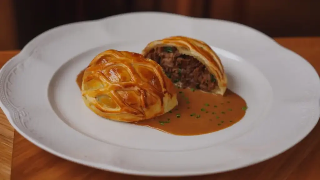 manual-shaping-and-plastic-wrapping-of-beef-tenderloin-for-beef-wellington-food-network