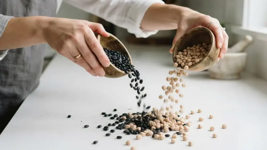 small-black-beans-and-chickpeas-scattered-on-a-clean-kitchen-counter
