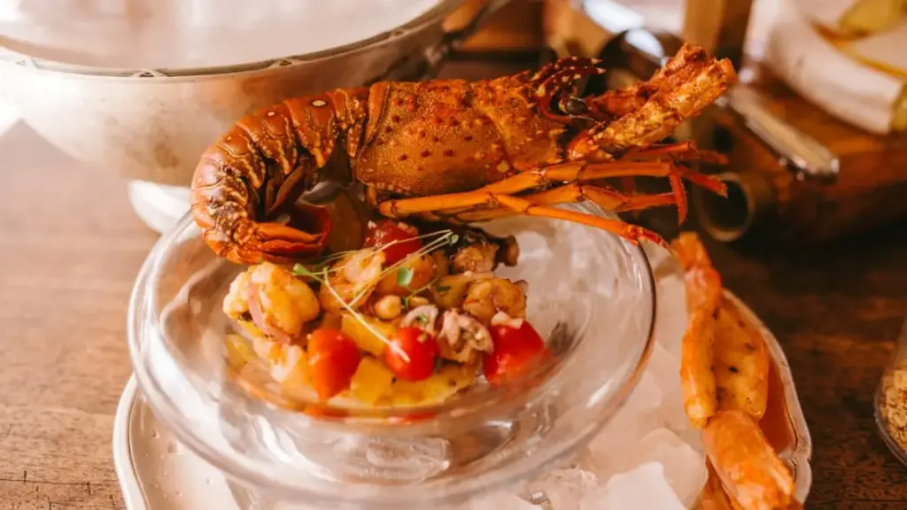 spreading-grated-cheddar-cheese-toppings-over-a-lobster-thermidor-recipe-easy-dish