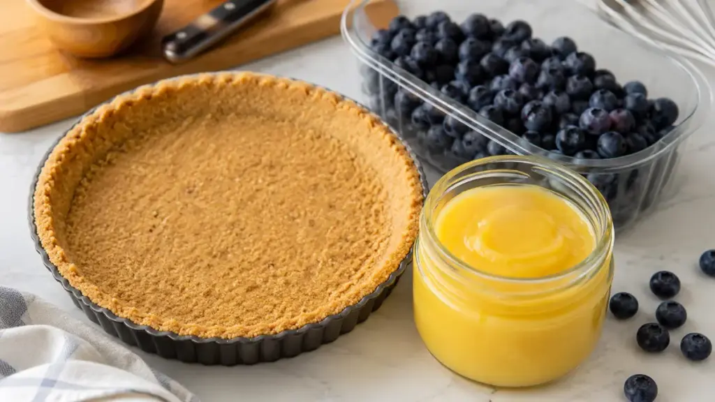 three-raw-ingredients-arranged-neatly-for-a-no-bake-blueberry-lemon-tart-recipe