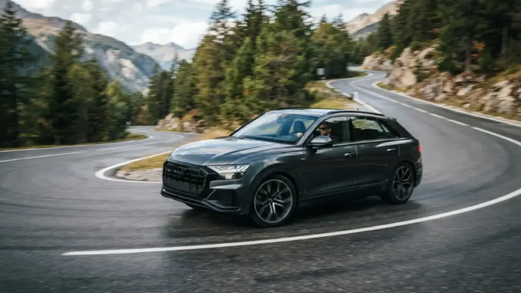 A luxury vehicle executing a smooth turn utilizing active curve inclination