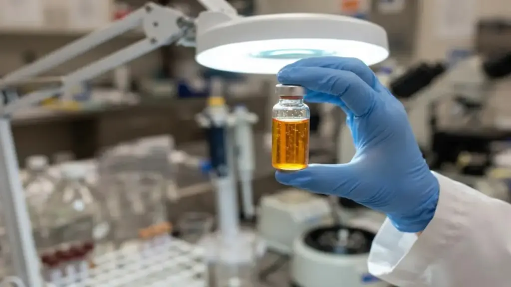 laboratory-technician-inspecting-animal-vitamin-vials-under-bright-lights-for-oakland-zoo