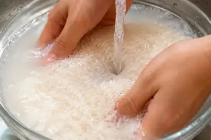 wash rice jasmine grains in water bowl